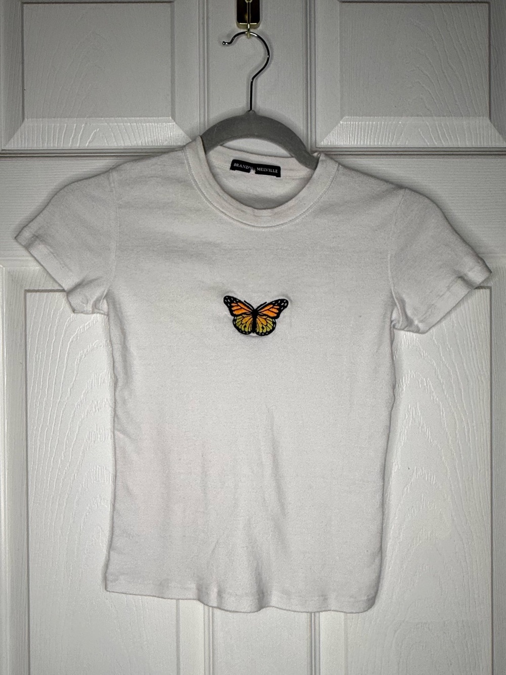 Brandy Melville White Tee with Orange Butterfly Patch one size